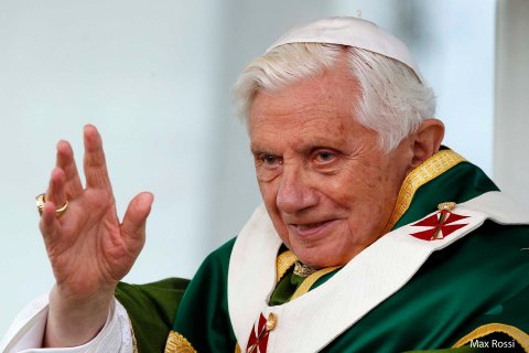 Pope Benedict XVI waves as he leads the Sunday mass during his one day pastoral visit to the Italian southern city of Lamezia Terme